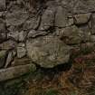 Detail of projecting stone at base of East wall.