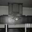 Interior. Detail of organ, clock, gallery front and columns