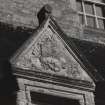 Detail of inscribed pediment of dormer window at old house.