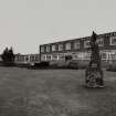 View from N of (L to R) statue, main Office buildings, and Canteen
Photographed 27 January 1994