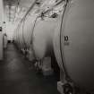 Bottling Hall: Vat Room, view from E showing some of 19 glass-lined steel vats.  Demineralised water is added at this stage to bring the alcohol down to bottle strength and carmel added to give the whisky colour.  Photographed 27 January 1994