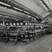 Bottling Hall: View from SE at Ground Level showing Black & White Whisky being bottled and put into cartons and boxes on Line No. 1.
Photographed 27 January 1994