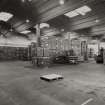 Empty Bottle Store: View from S showing stocks of empty bottles, made by United Glass at Alloa, awaiting loading into the neighbouring bottling line.
Photographed 27 January 1994