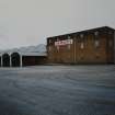 View from W of (R to L) Material Store, and vaulted canopy at NW frontage of Empty Bottle Store, adjacent to Bottling Store.
Photographed 27 January 1994