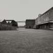 General view from SE of W side of bottling complex, showing (L to R) the Temporary Machine Store, Bulk Storage, North and South Bonded stores, Materials Stores and Bottling Hall
Photographed 27 January 1994