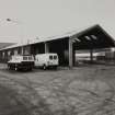 General view from W of Garage, with SW end illustrating its frame of reinforced concrete
Photographed 27 January 1994