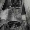 Interior. Detail in water-wheel house of gearing and vertcial line shaft taking power to mill