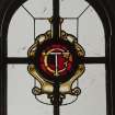 Orchil House, interior.
Detail of staircase hall stained glass window with TC monogram.