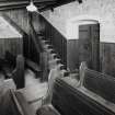 Interior, pews and stair to E gallery, detail