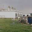 View of keeper's house from NE (with oil-rig construction yard's jacket nearing completion in background)