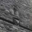 Detail of carved panel on N side of tower.