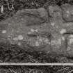 Detail of fragment of cross incised stone slab.
