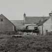 Farmhouse and former shop, view from W