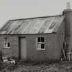 Corrugated-roofed building to SW of farmhouse, view from NE