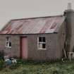 Corrugated-roofed building to SW of farmhouse, view from NE