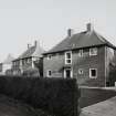 View from W of detached Officers' houses at SW end of Rosetrees Lane (NY 348 672)