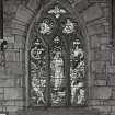 Interior of the Chapel, view of stained glass window in West wall