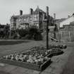 Main house and flower bed and pillar, view from South East.