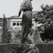 Statue of girl by Pilkington Jackson, to South West of main house, view from South.