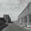 View from E showing Broadloom Department (right), and packing, finishing and disused office block (left)