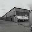 View from N of E side of Wire Division's South Mill, in which the foundry and annealing departments are located.  This unit produces rod, which is then taken to the North Mill to be drawn into wire