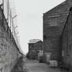 View from SW along N side of Wire Division's North Mill, also showing water tank