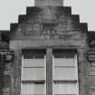 Detail of finialled crowstepped dormer gable with initials