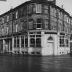 1, 2 Howard Place.
View from South of pub and shop fronts, additions to what was probably domestic property.
