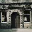 Courtyard. W range. View of doorway with flanking windows