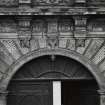 N facade. View of carved frieze above main entrance