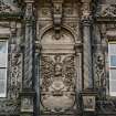 N facade. Detail of decorative panel above main entrance