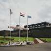 General view from NW within compound of main production and bottling block, with flagpoles in foreground