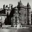 General view of South East corner of Holyrood Palace, with Fountain in foreground