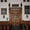 Interior. Chapel. View of doorway and pews from S