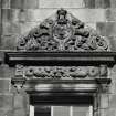 Courtyard. Detail of specimen window tympanum