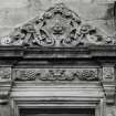 N facade. Detail showing carved pediment