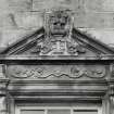 N facade. Detail showing pediment broken by flower finial