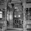 Interior, 2nd floor, billiard-room, view of east end showing carved screen and chimneypiece