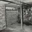 Edinburgh, Morrison Street, George Lindsay Glaziers, interior.
View in Basement of cast-iron column and beam.