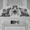 Interior. Auditorium, detail of pediment above door at front of stalls