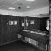 Interior. 1st floor, ladies lavatories, view showing wash hand basins and mosaic tiling