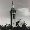 General view of St Peter's Church with scaffolding on the spire seen from the West.