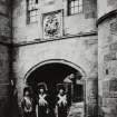 Detail of Netherbow Port in 'Old Edinburgh Street' exhibit, insc: 'Old Town Guard.   M. Wane, Copyright'