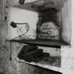 Detail of oven door, also showing baking tins