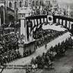 View from north east showing Royal Arch and St John's Episcopal Church (postcard).
Insc: 'Royal visit to Edinburgh, 1911', 'Yeomanry Escort passing under Triumphant Arch, West End'.
NMRS Survey of Private Collections.