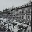 View from north west showing a ?royal visit with procession and spectators.  The North British is under construction.