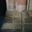 Interior. Detail of chancel arch base showing slot