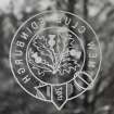 Interior. Ground floor, entrance, detail of crest etched in fanlight above door