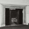 First floor, south east room, detail of fireplace.