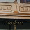 Interior, ground floor, assembly hall, detail of balcony front and column capital